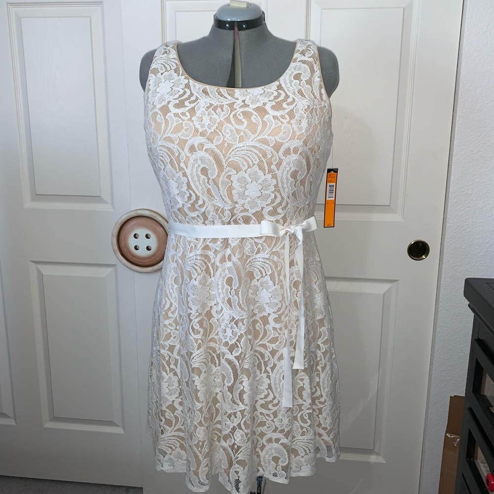 Adorable lace overlay dress for special occasion.